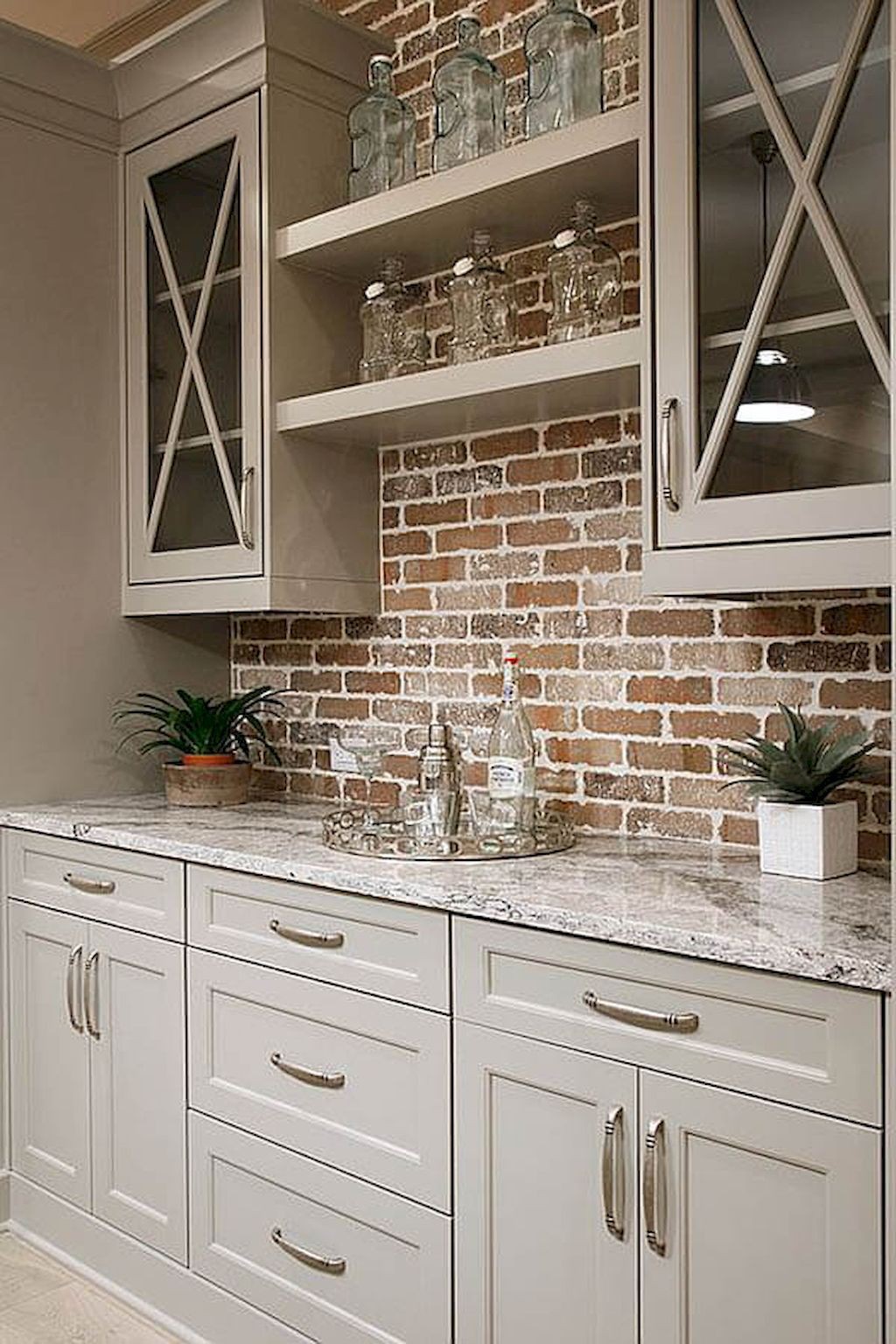 Brick backsplash gray cabinets