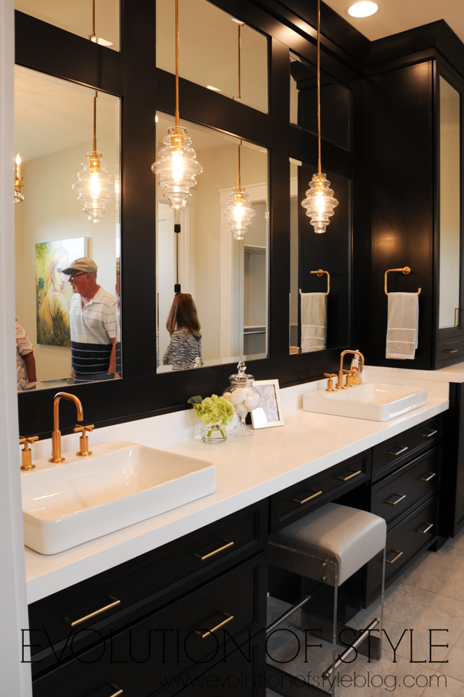 Master bathroom with black cabinets and gold hardware