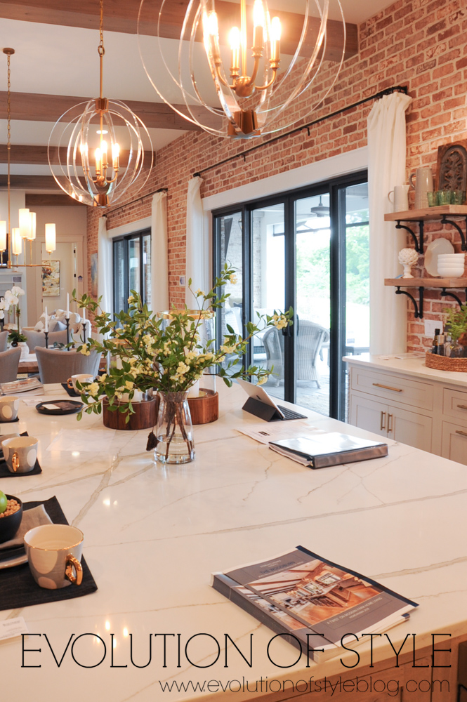 Exposed brick kitchen with large island