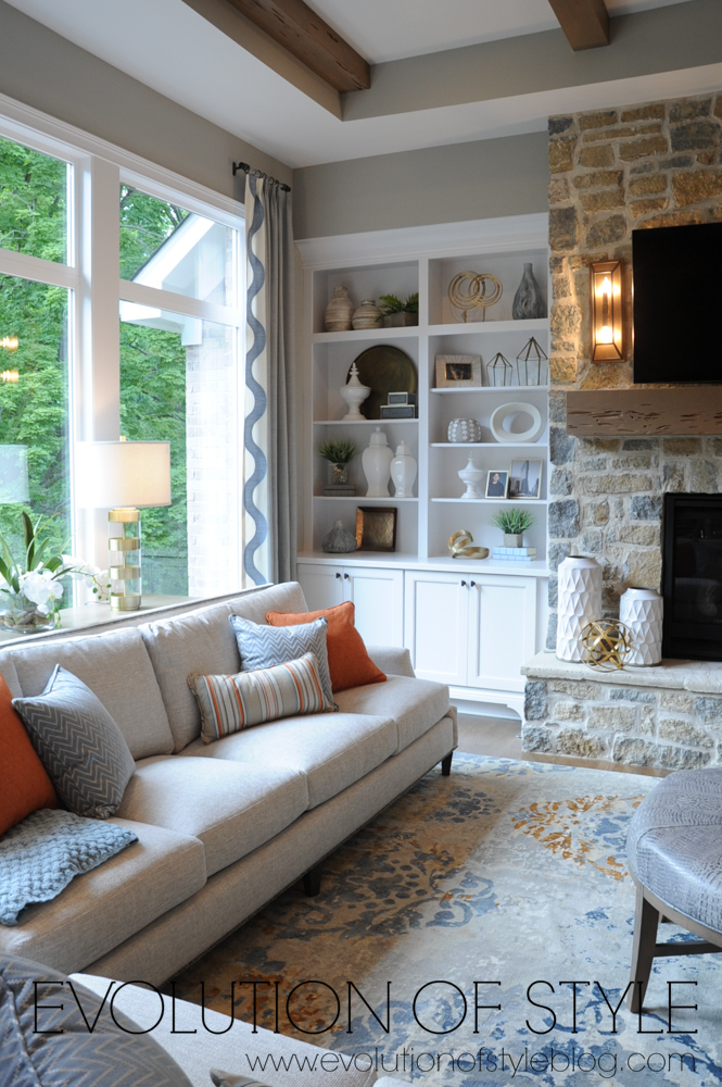 Living room with built-ins and stone fireplace