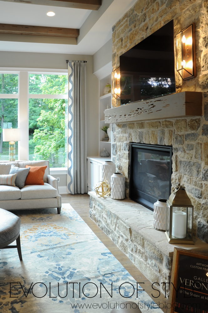 Stone fireplace with wood mantel